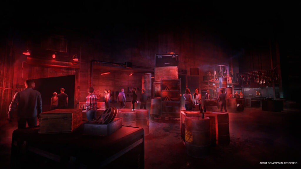 A dark, industrial-themed environment filled with people casually exploring the space, designed with dim red lighting and scattered barrels, crates, and shelving units. Some guests stand near a table with empty bottles, while others move through the warehouse-like setting. The atmosphere suggests a moody, immersive experience. A caption reads "Artist Conceptual Rendering.